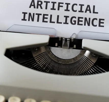 Typewriter with paper labeled artificial intelligence