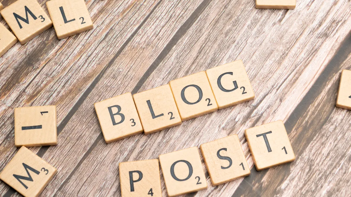 What Features Matter Most in AI Blog Writing Tools? — Blog post with scrabble letters spelling out blog post